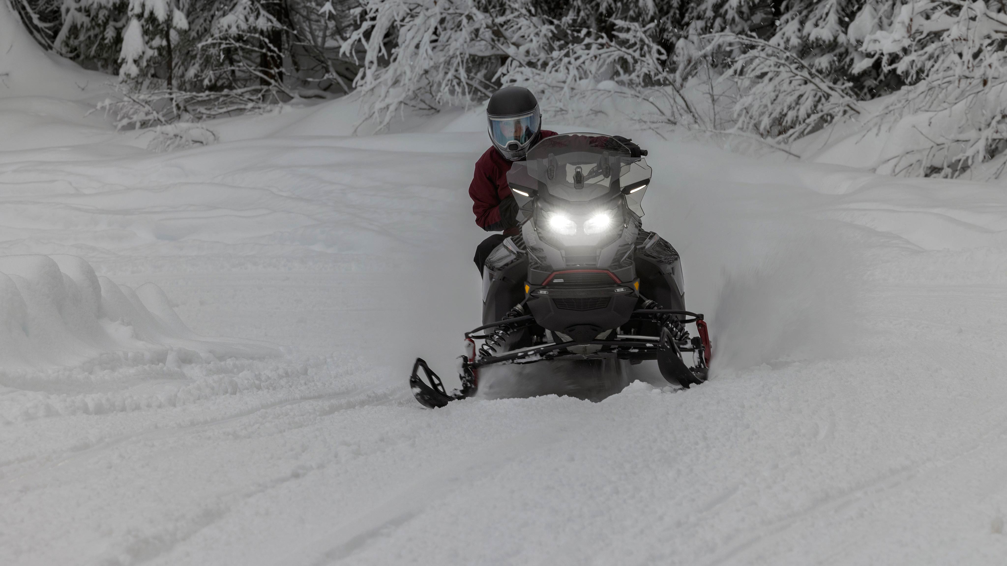 Rider carefully navigating a snowy trail on a 2025 Ski-Doo Renegade