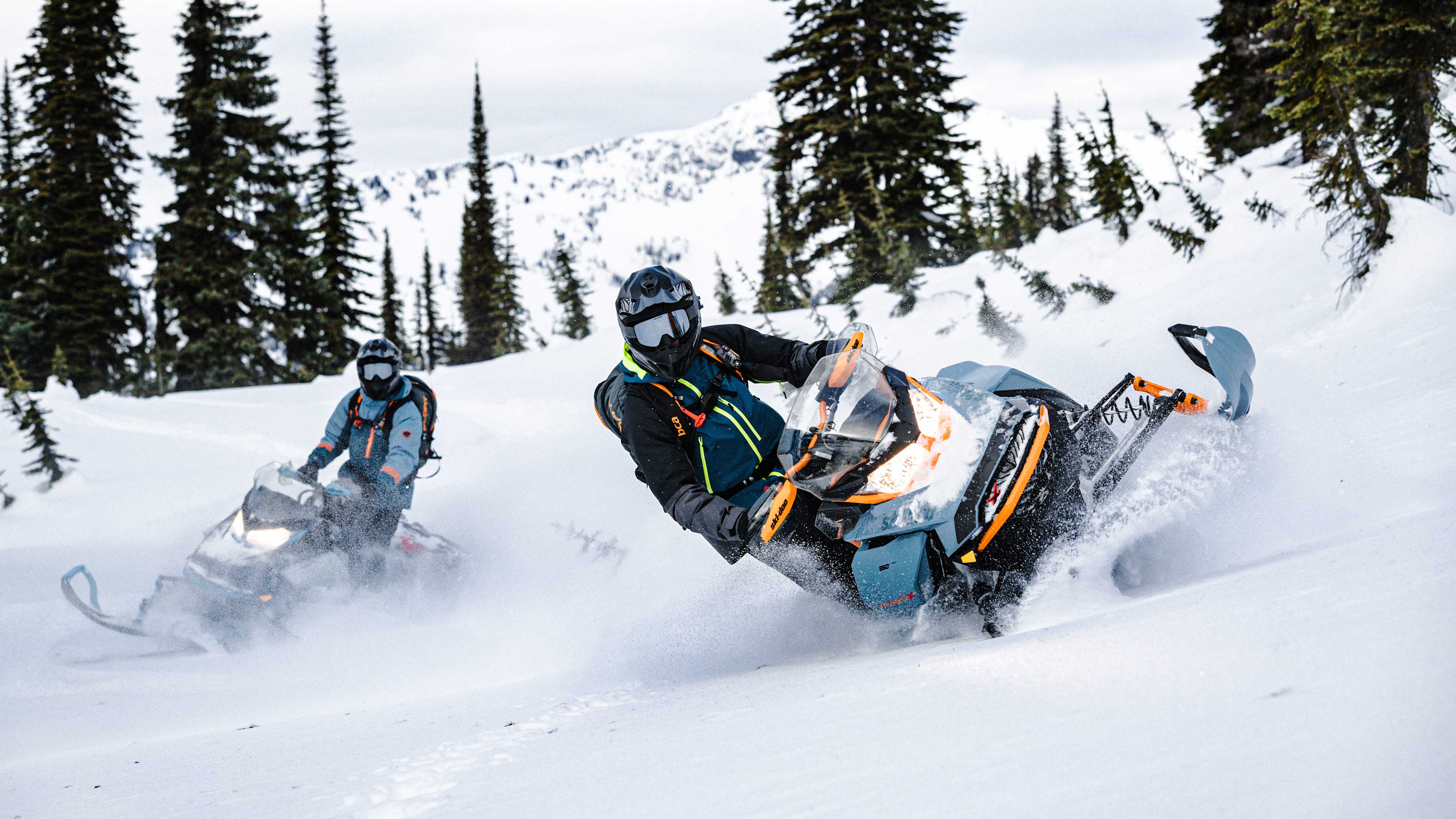 2 riders riding the new 2022 Ski-Doo Backcountry
