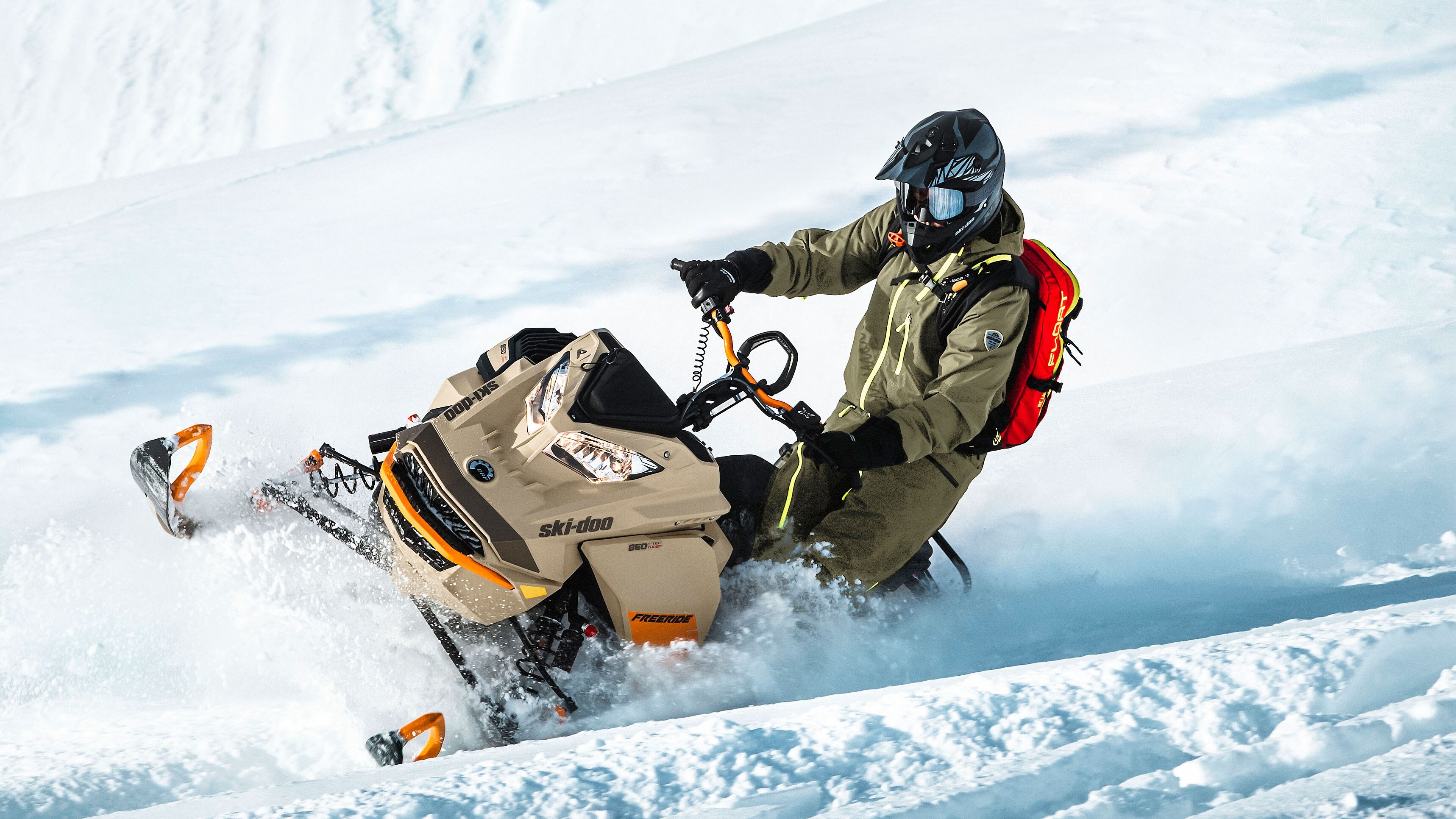 Man riding deep snow with Ski-Doo Freeride