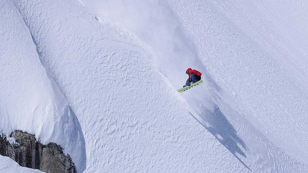 Craig McMorris snowboarding in a mountain