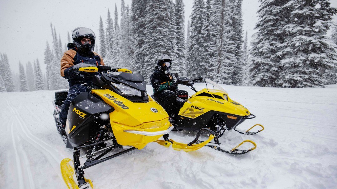 Father and his son during a snowmobile ride with their Ski-Doo MXZ