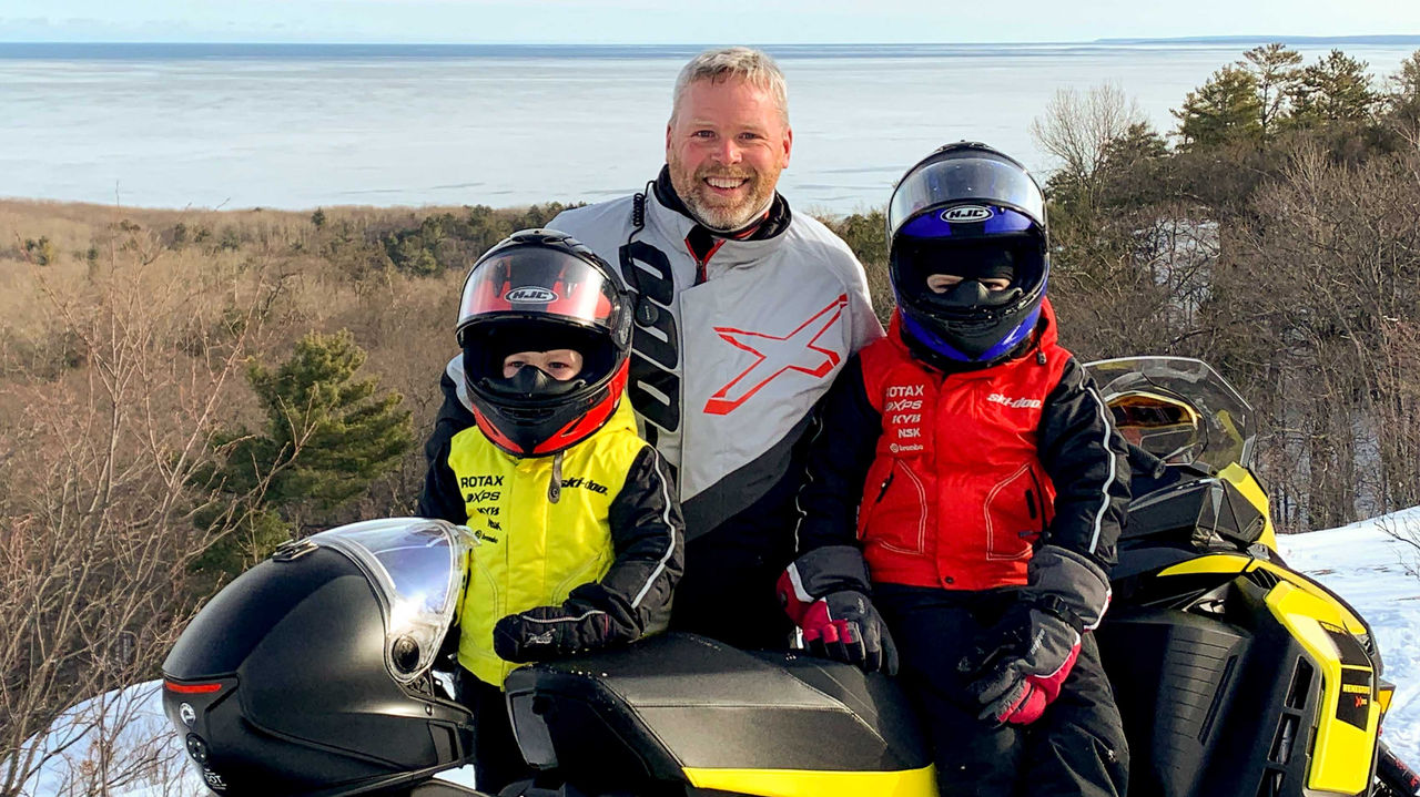 Troy Oleson and his two kids on a Ski-Doo