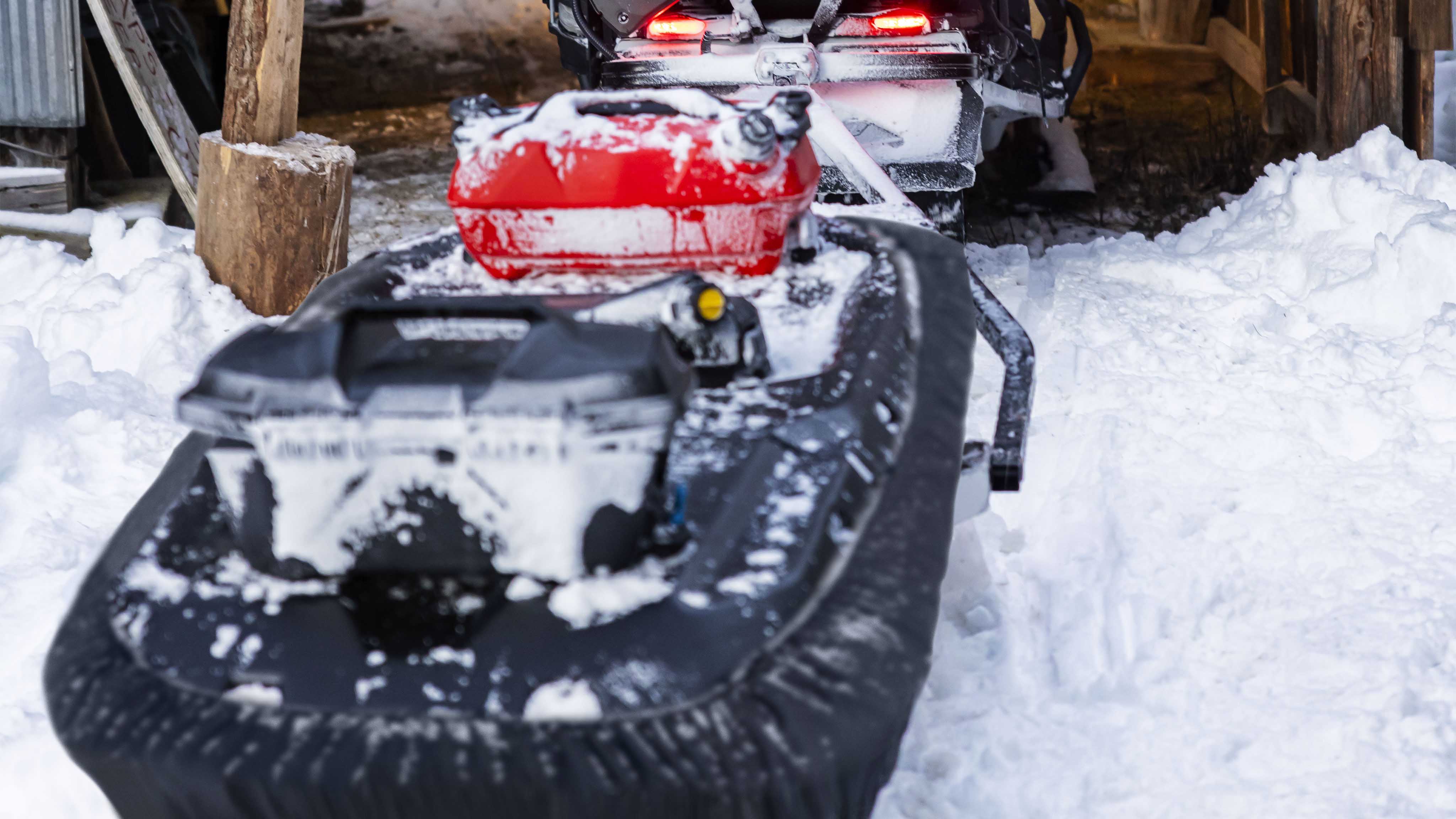 Snowmobile equipped with LinQ Storage and fuel accessories