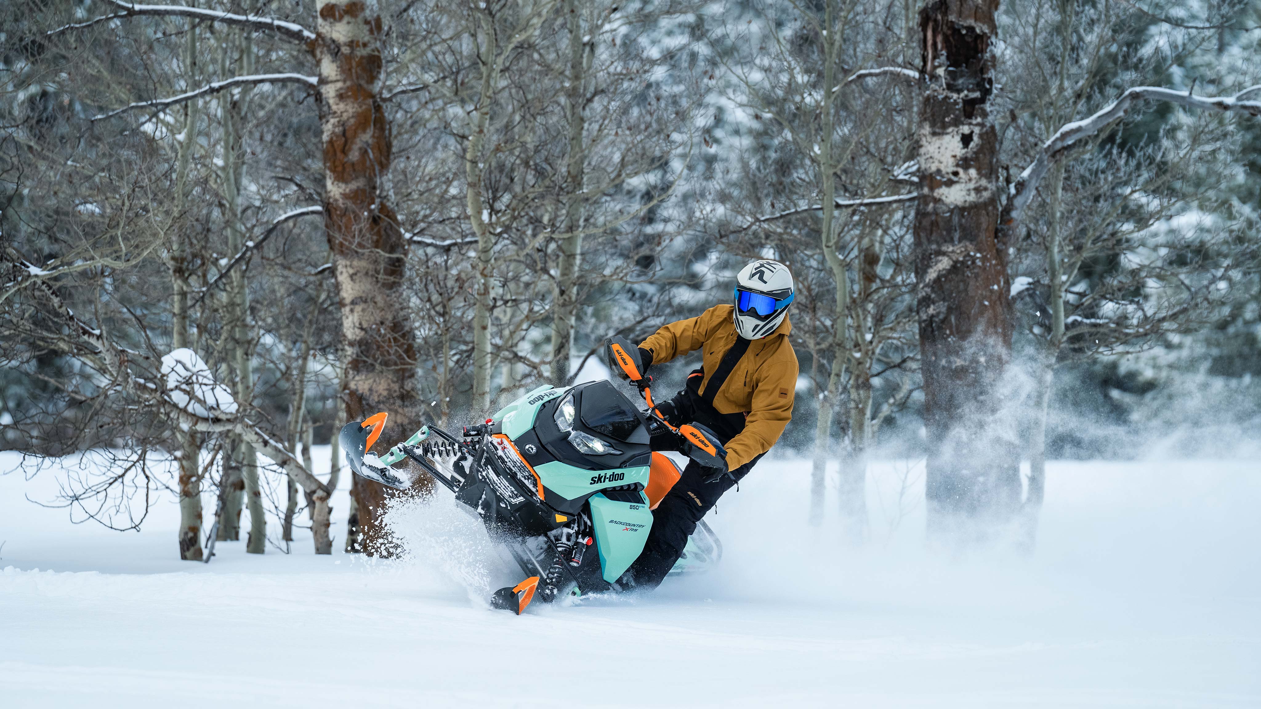 Man riding off-trail with a Backcountry X-RS