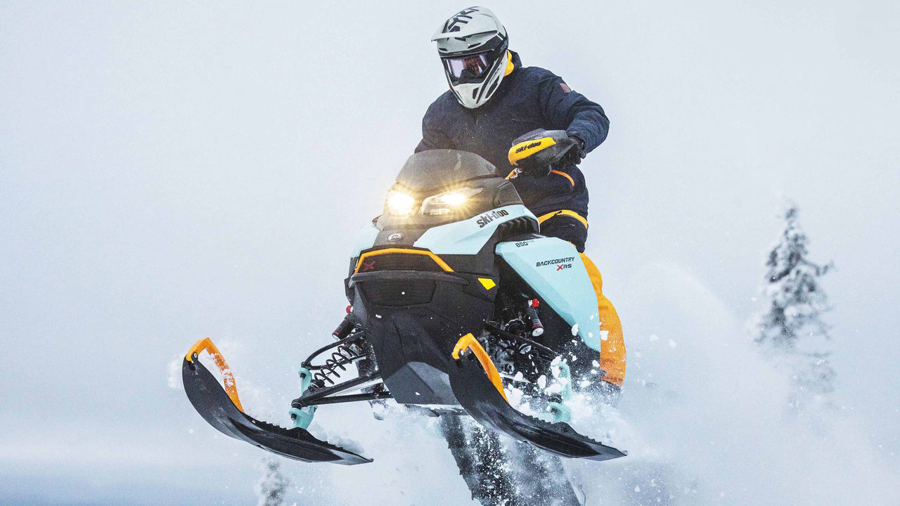 Man jumping with his Ski-Doo Backcountry X-RS