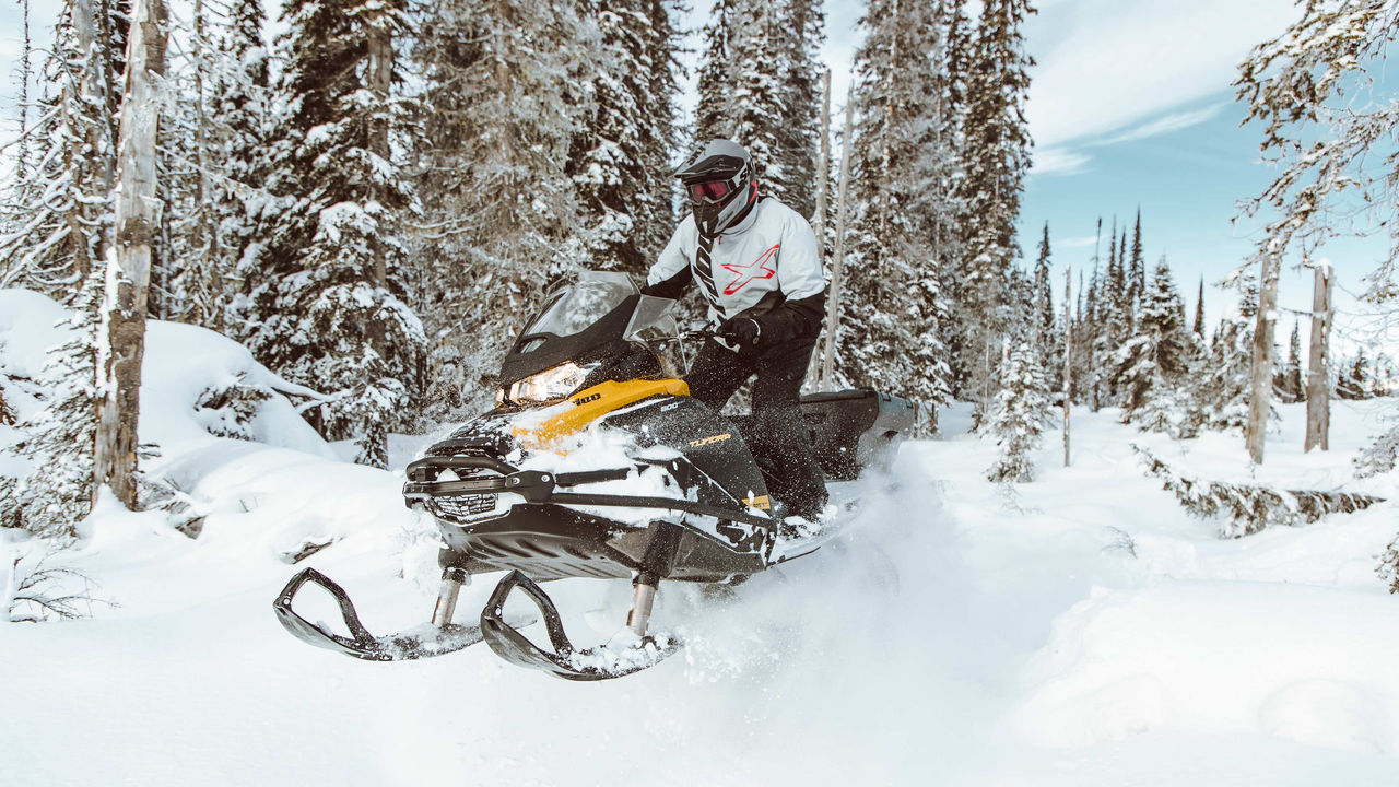 Man jumping with a Ski-Doo Tundra snowmobile