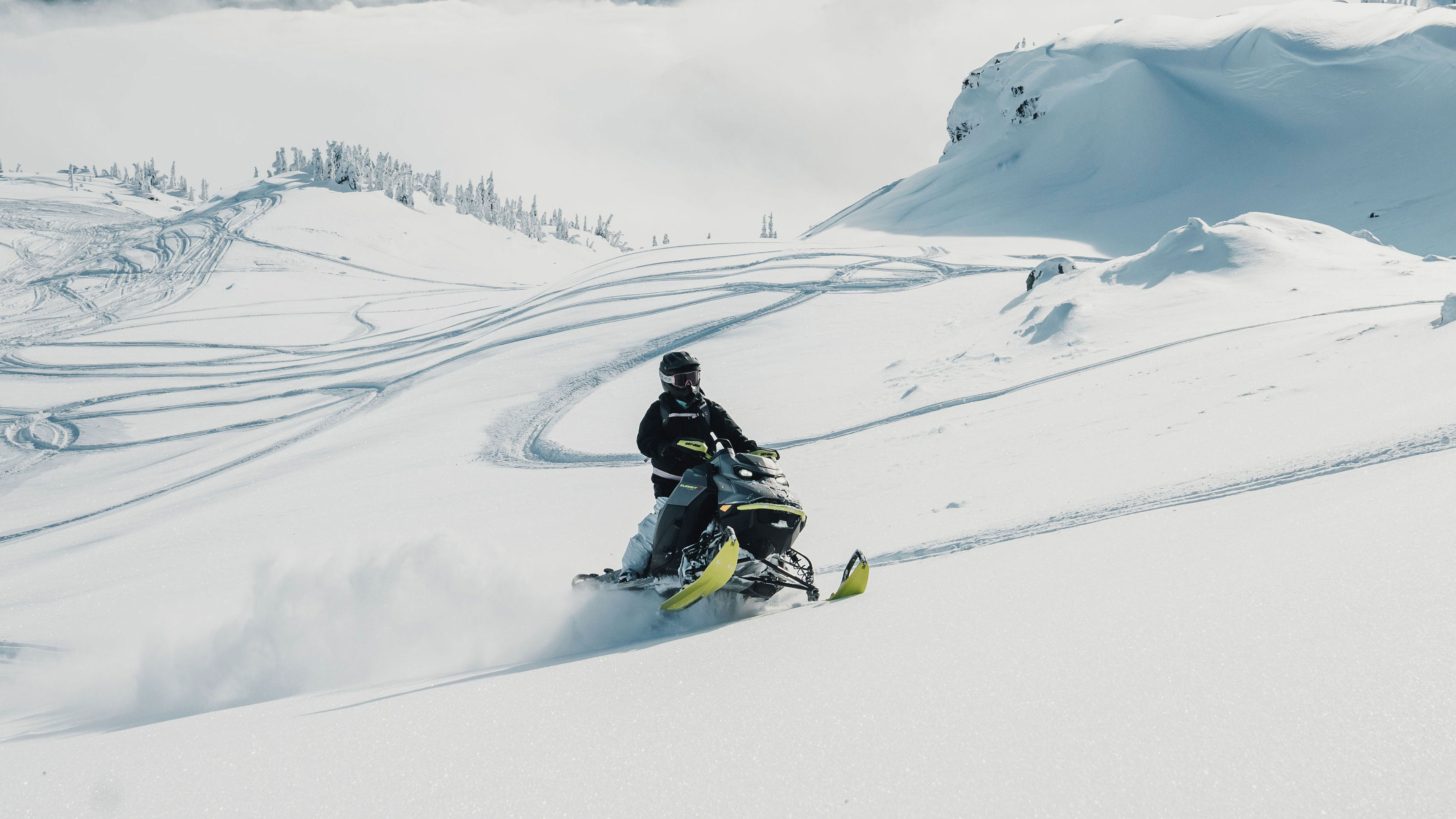 Jamie Anderson driving a Ski-Doo Summit