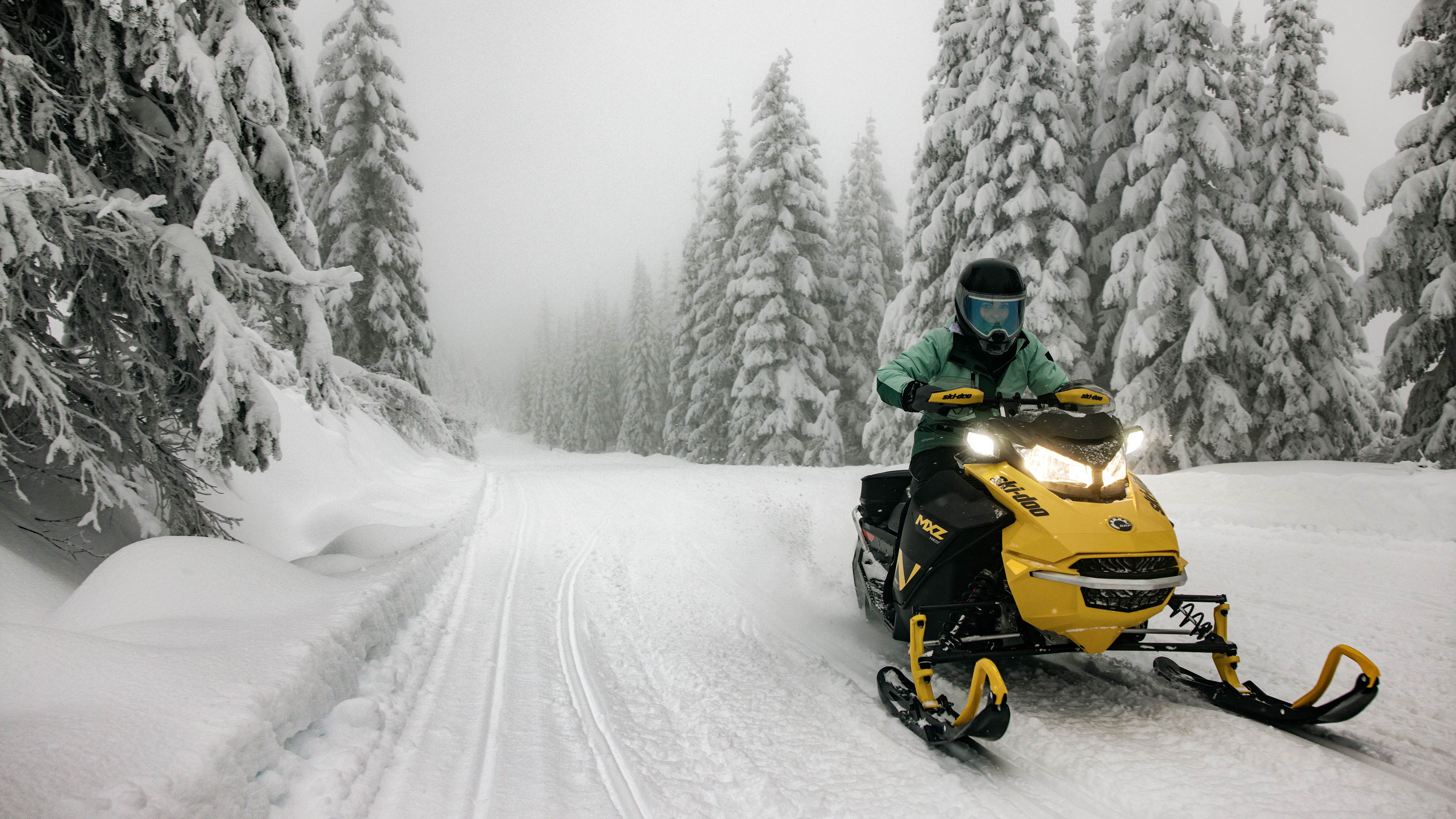 2025 Ski-Doo MXZ NEO riding on a snowy trail