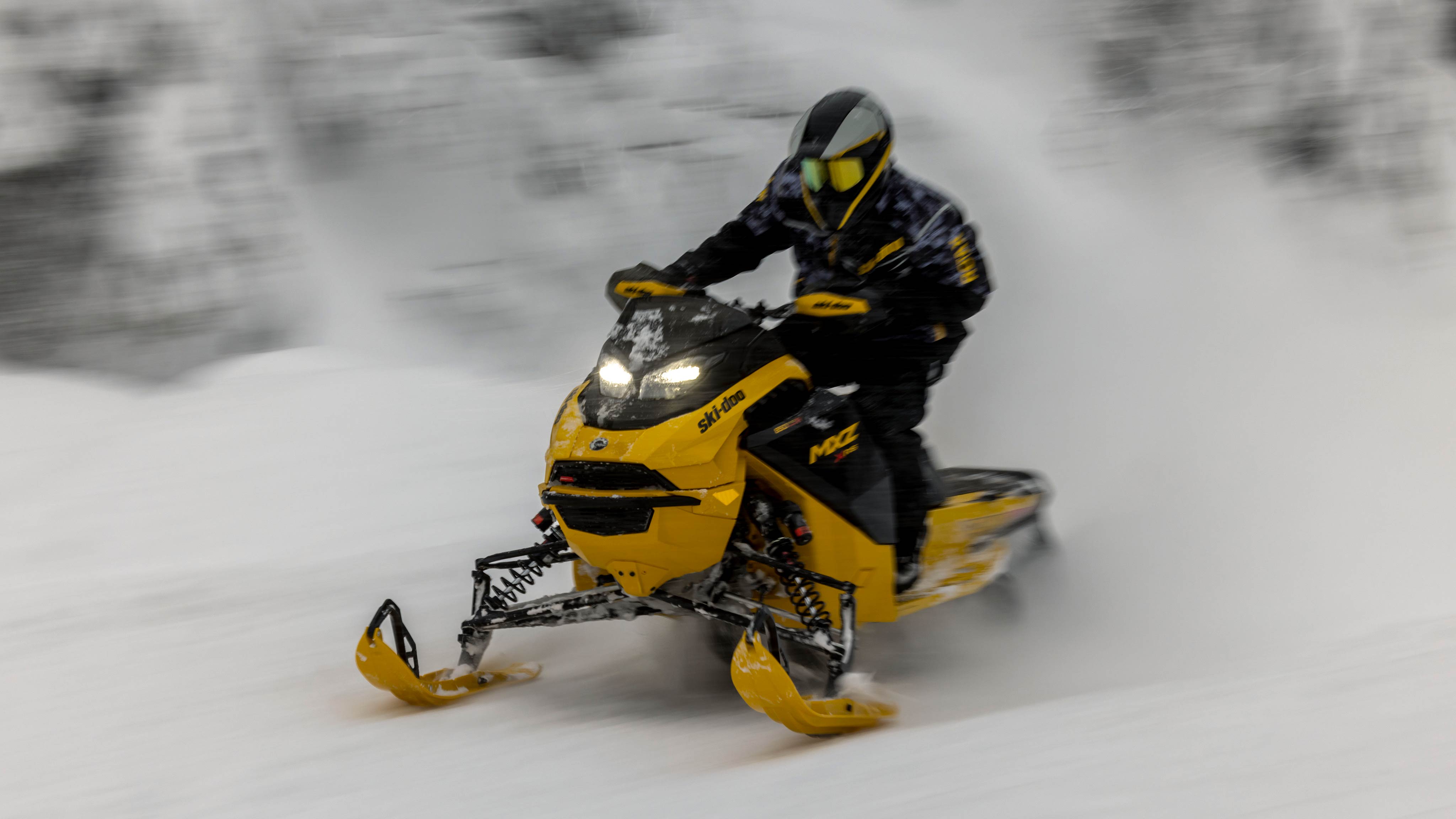 2025 Ski-Doo MXZ snowmobile going at high speed