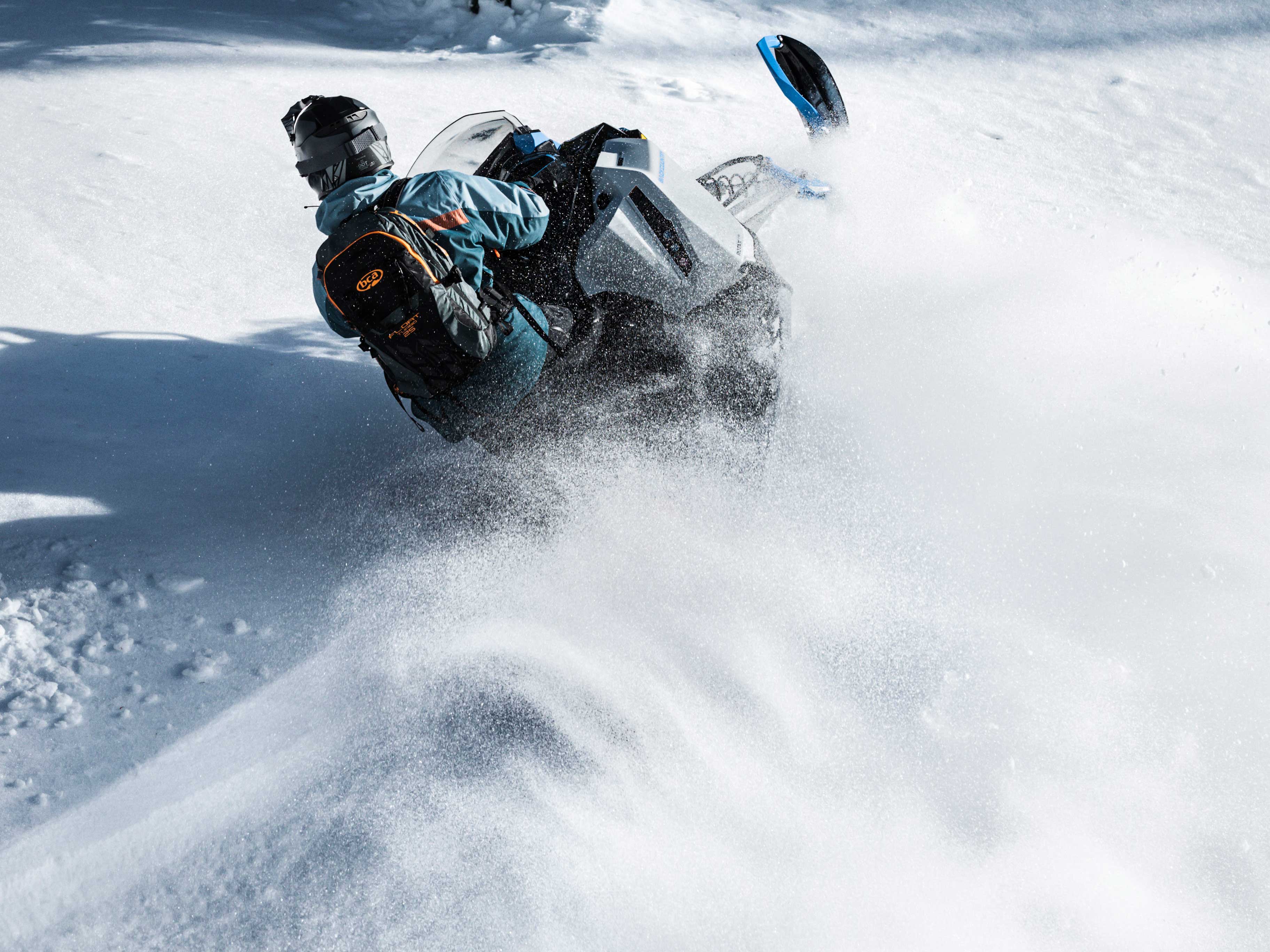 Man carving Powder with a 2022 Ski-Doo Backcountry.