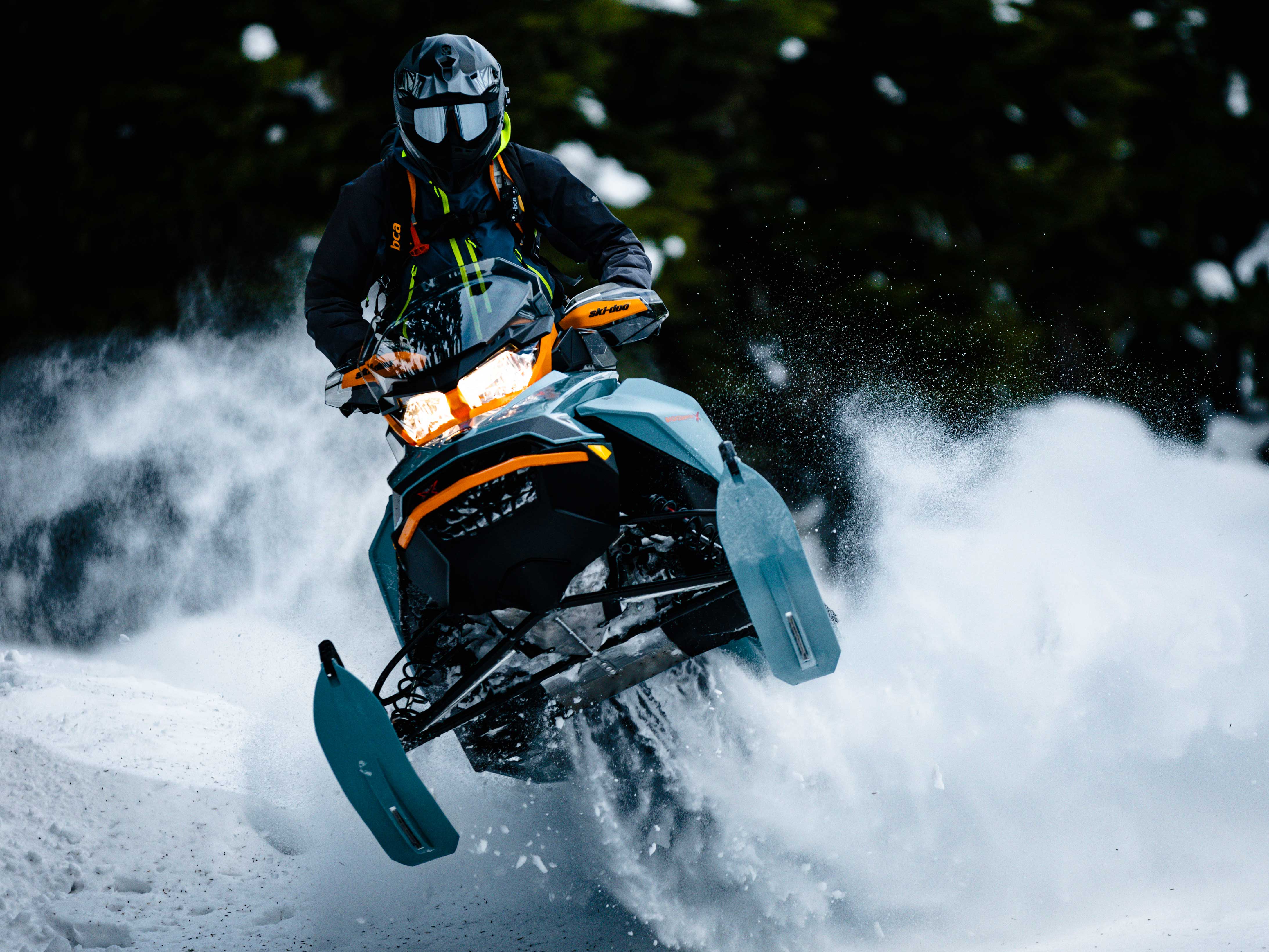 Man jumping in Powder with a 2022 Ski-Doo Backcountry