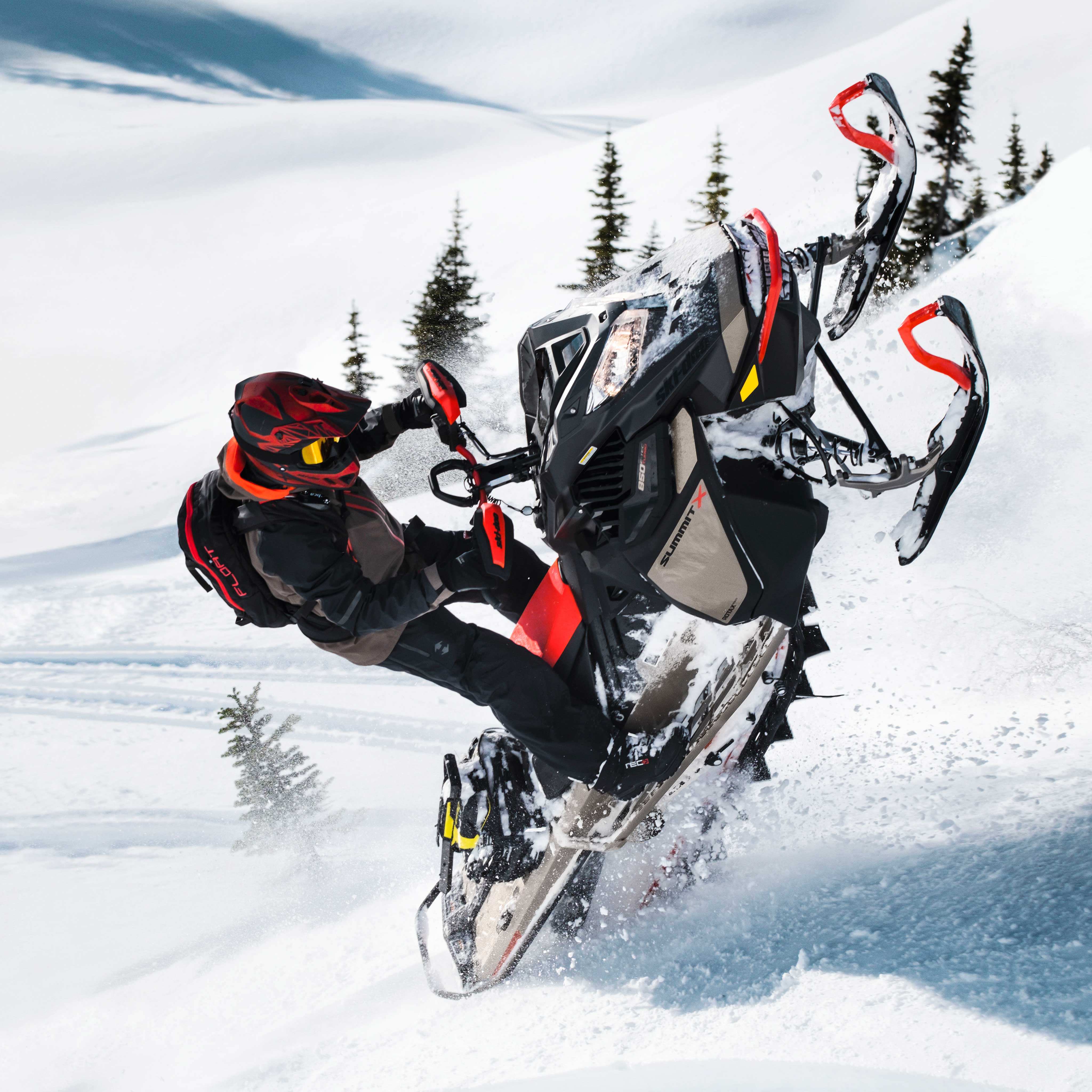 Man riding a Ski-Doo Summit with accessories