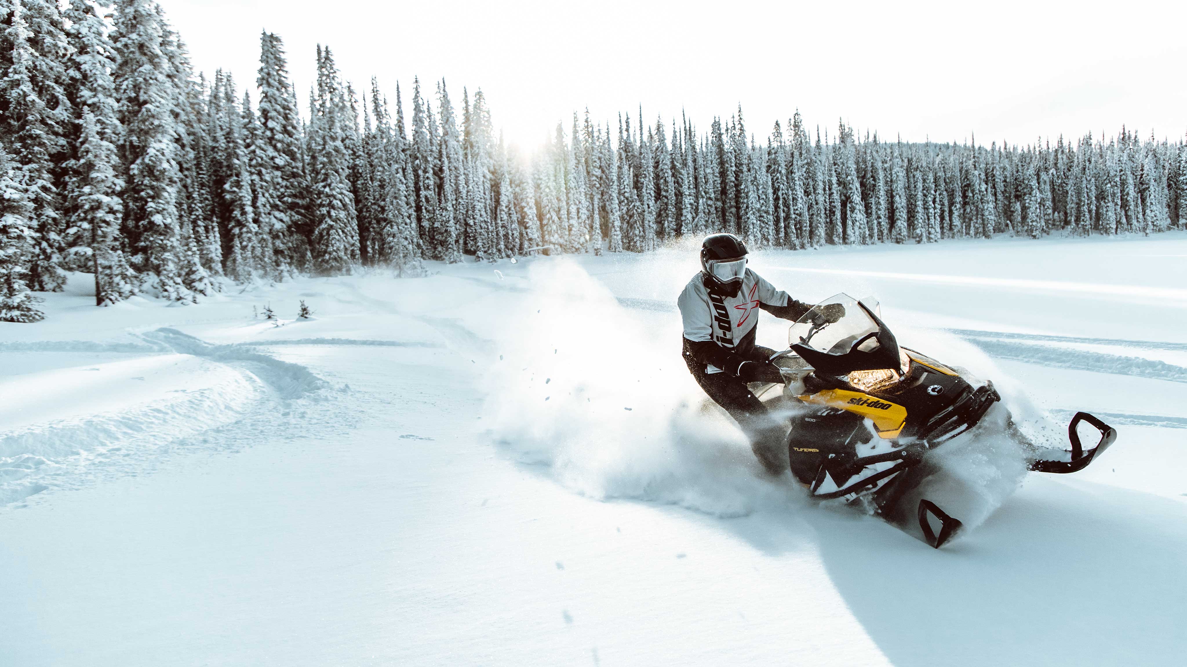 Man riding a Ski-Doo Tundra in deep snow