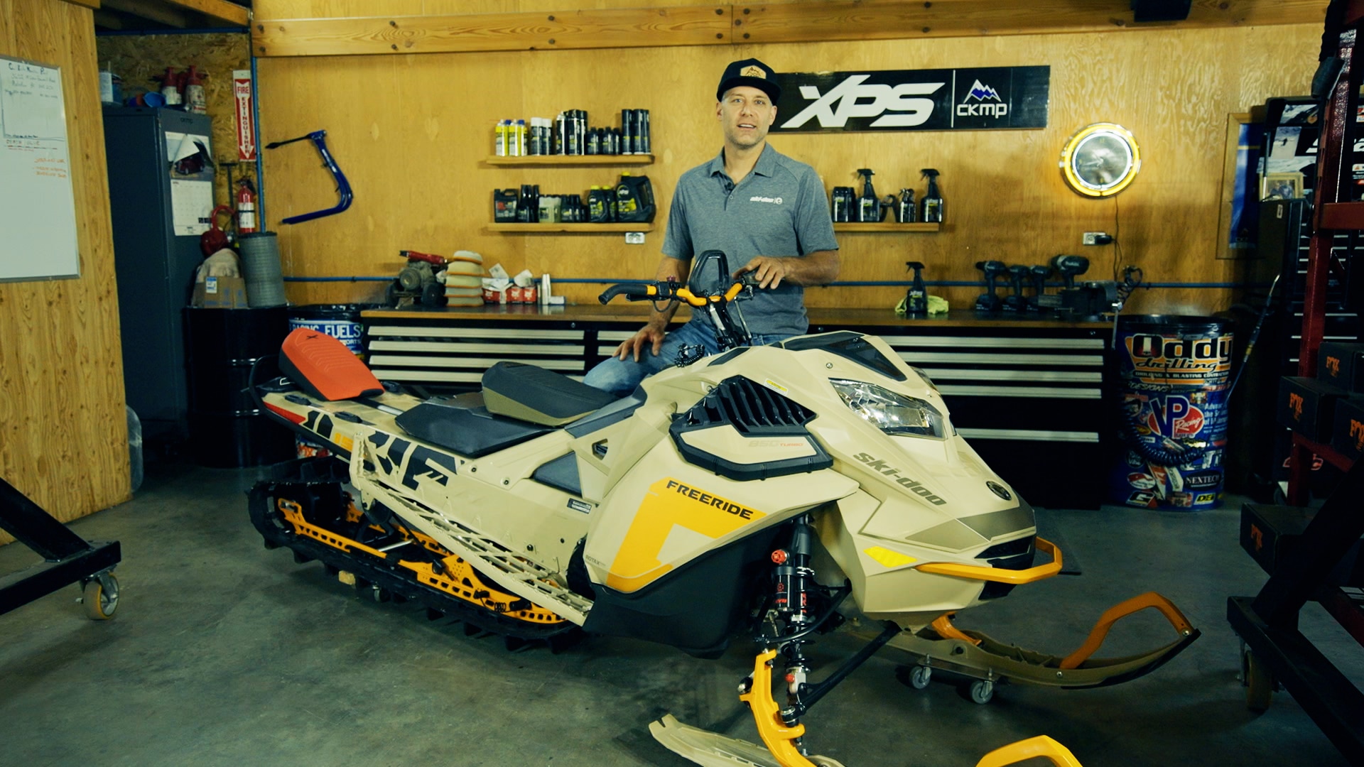 Carl Kuster customizing his deep snow snowmobile