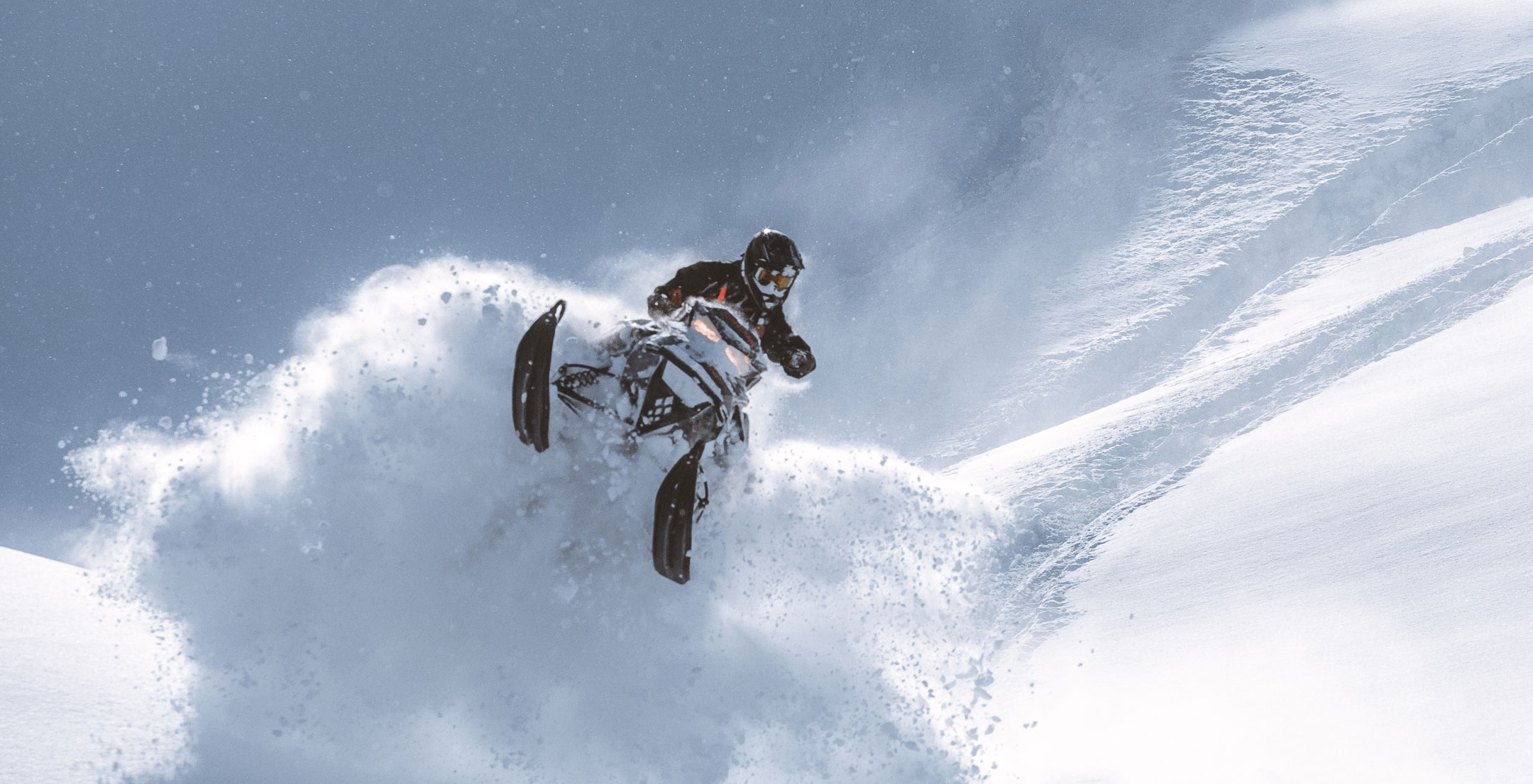 Ski-Doo Ambassador Cody McNolty jumping a cliff with his Ski-Doo snowmobile