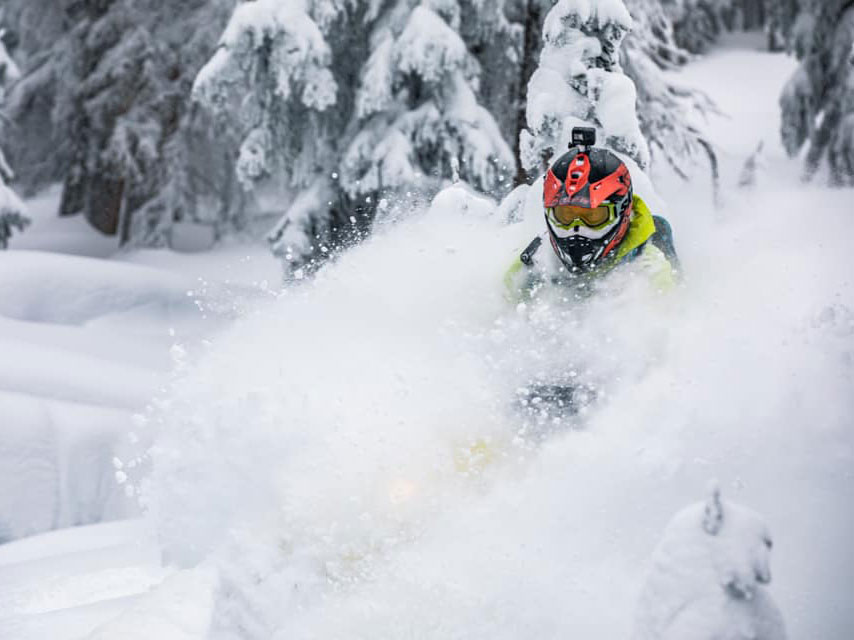 Jeremy Mercier riding snowmobile in Deep-Snow