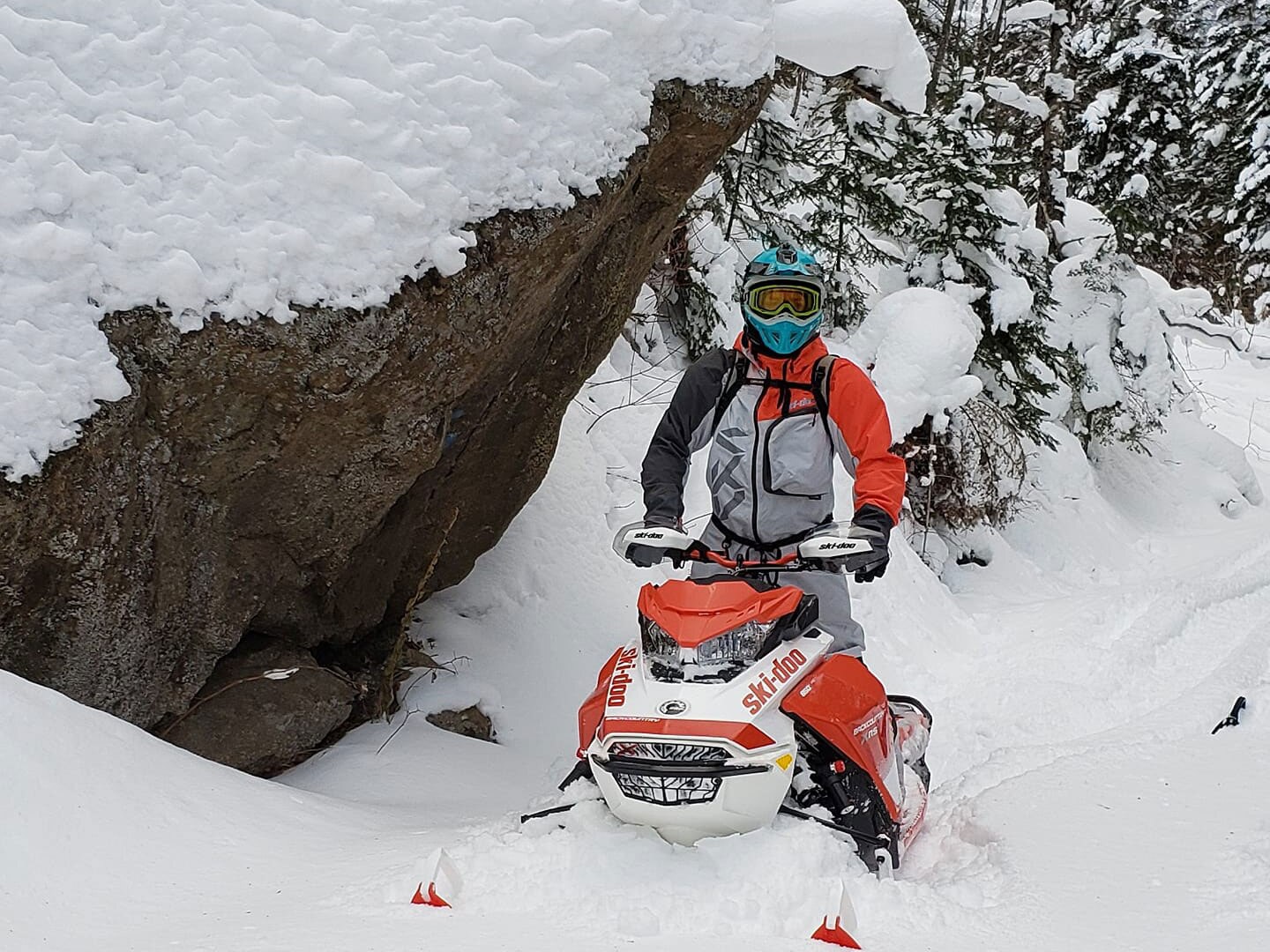 Matt Downey riding snowmobile in Deep-Snow