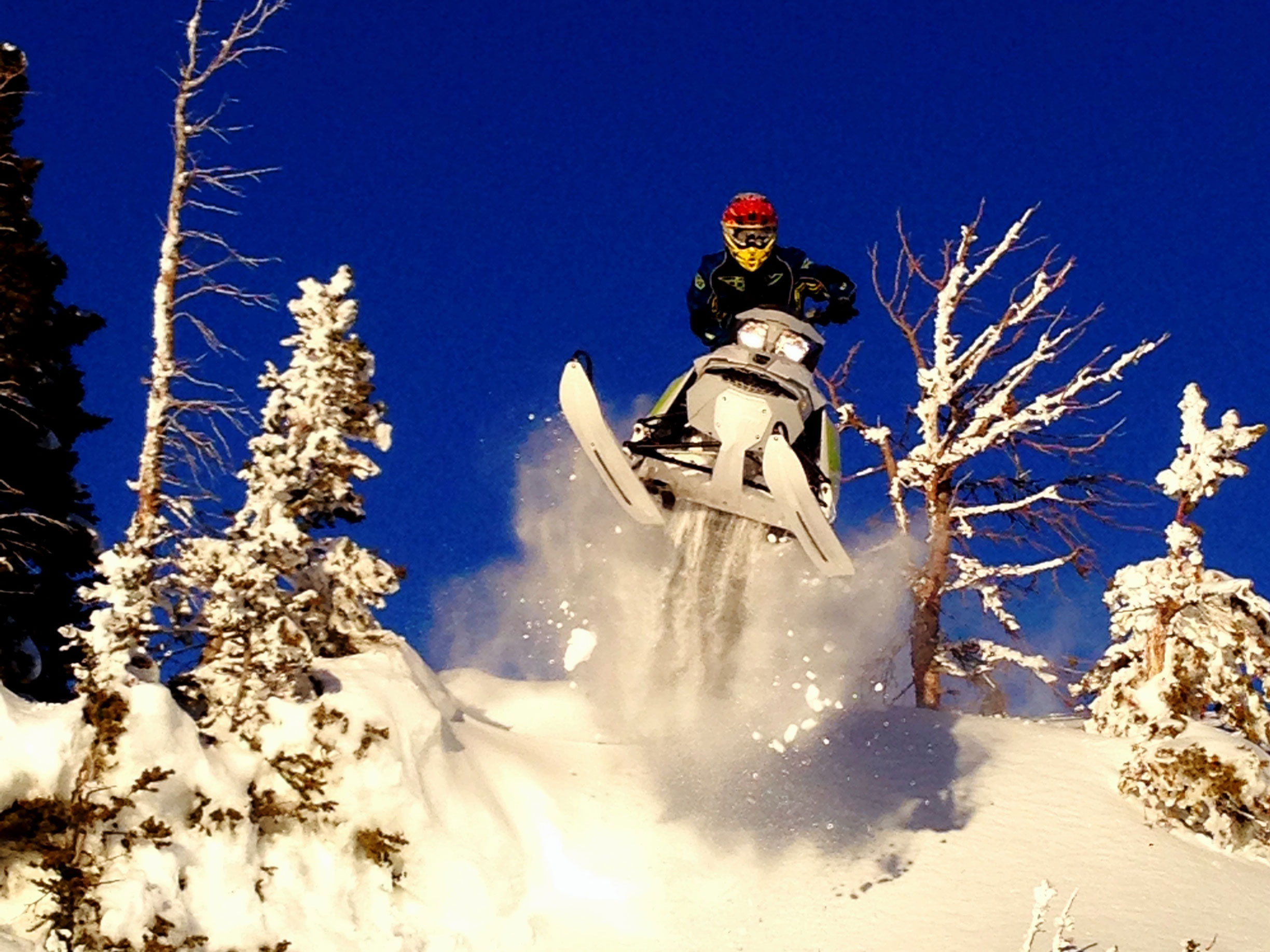 Steve Martin jumping on his Ski-Doo snowmobile
