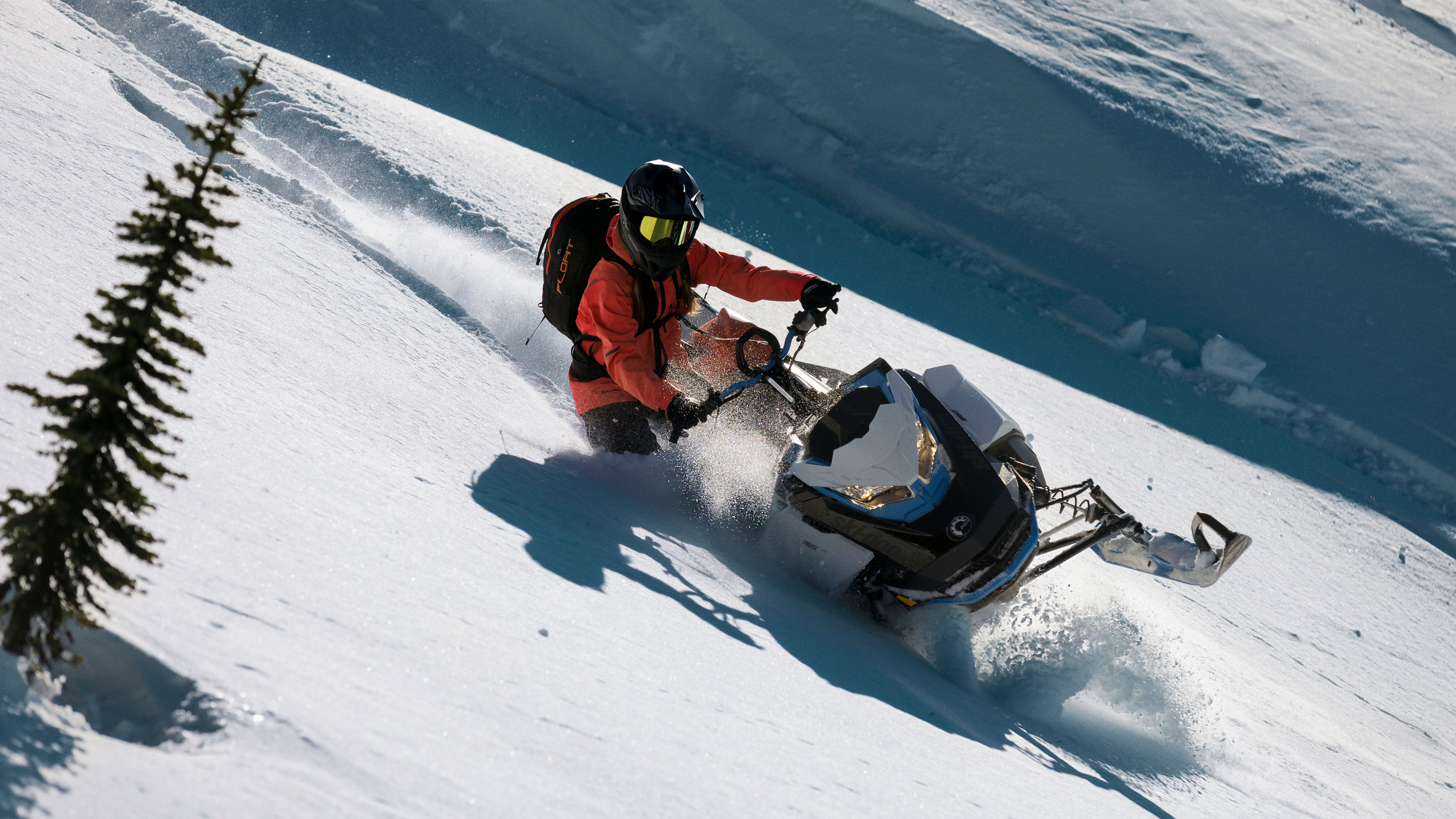 Women riding the new Summit Edge in deep snow