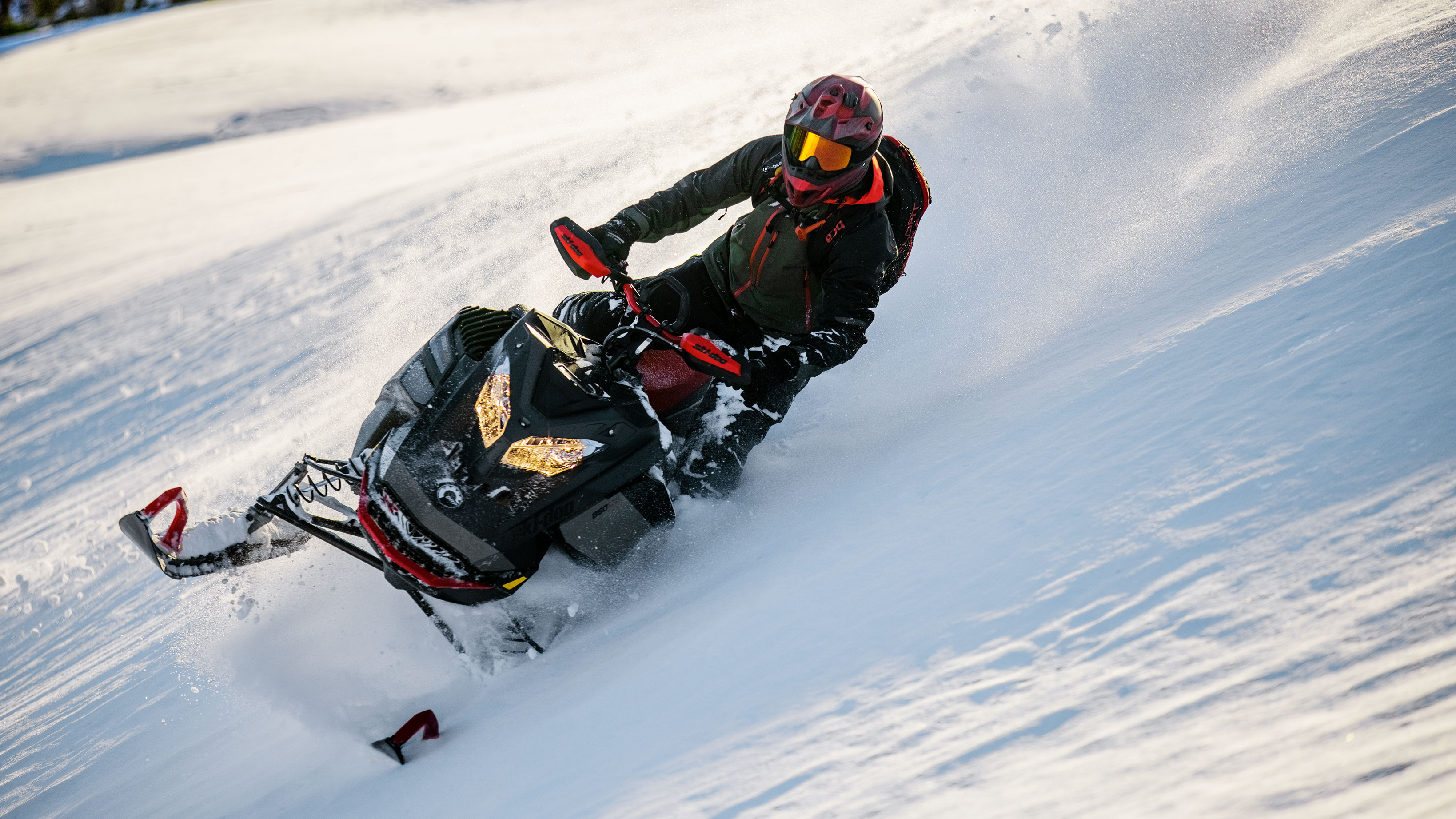 Men riding in deep Snow with a Ski-Doo Sumit