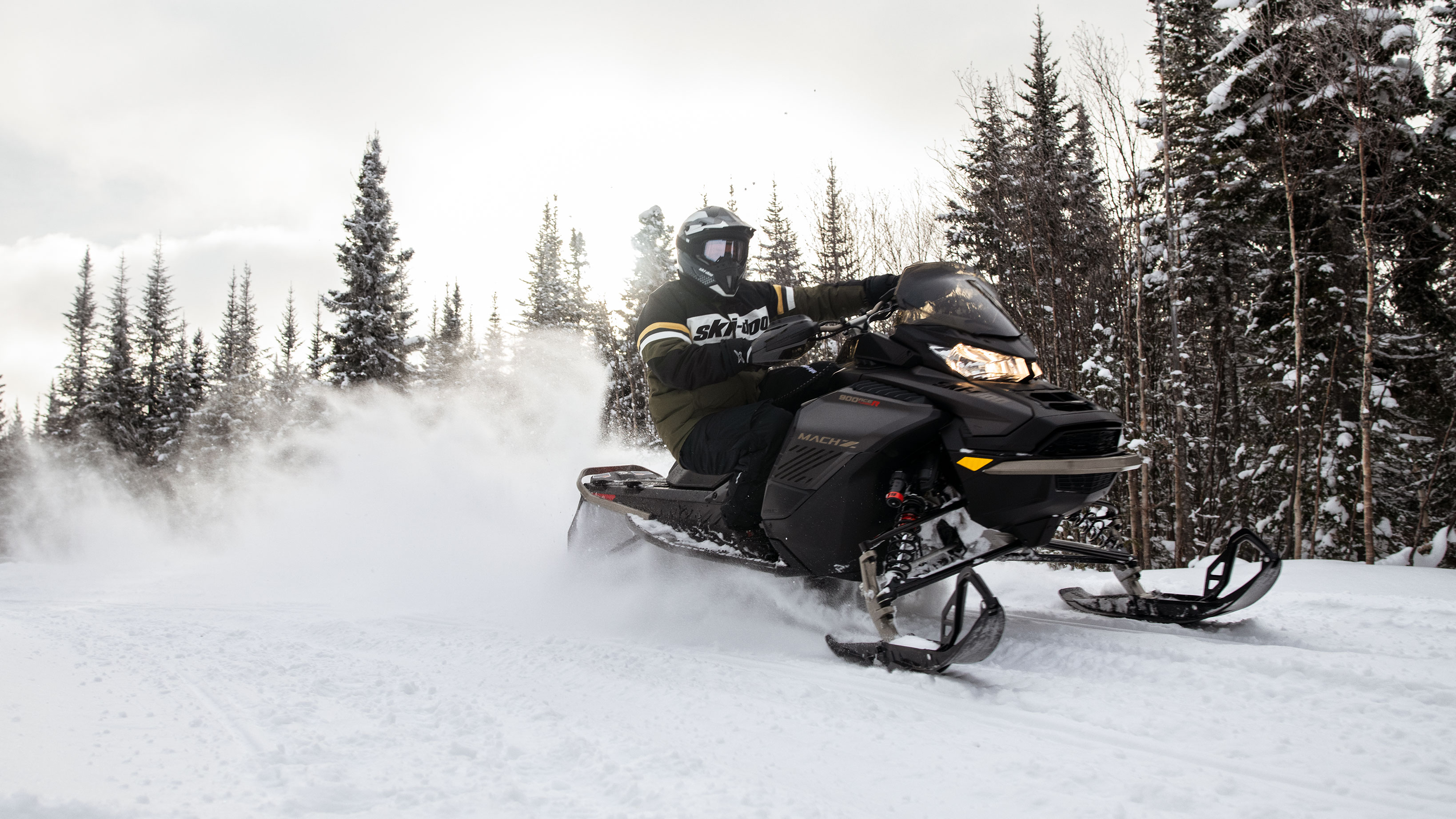 Man and his 2022 Ski-Doo Mach-Z on a trail