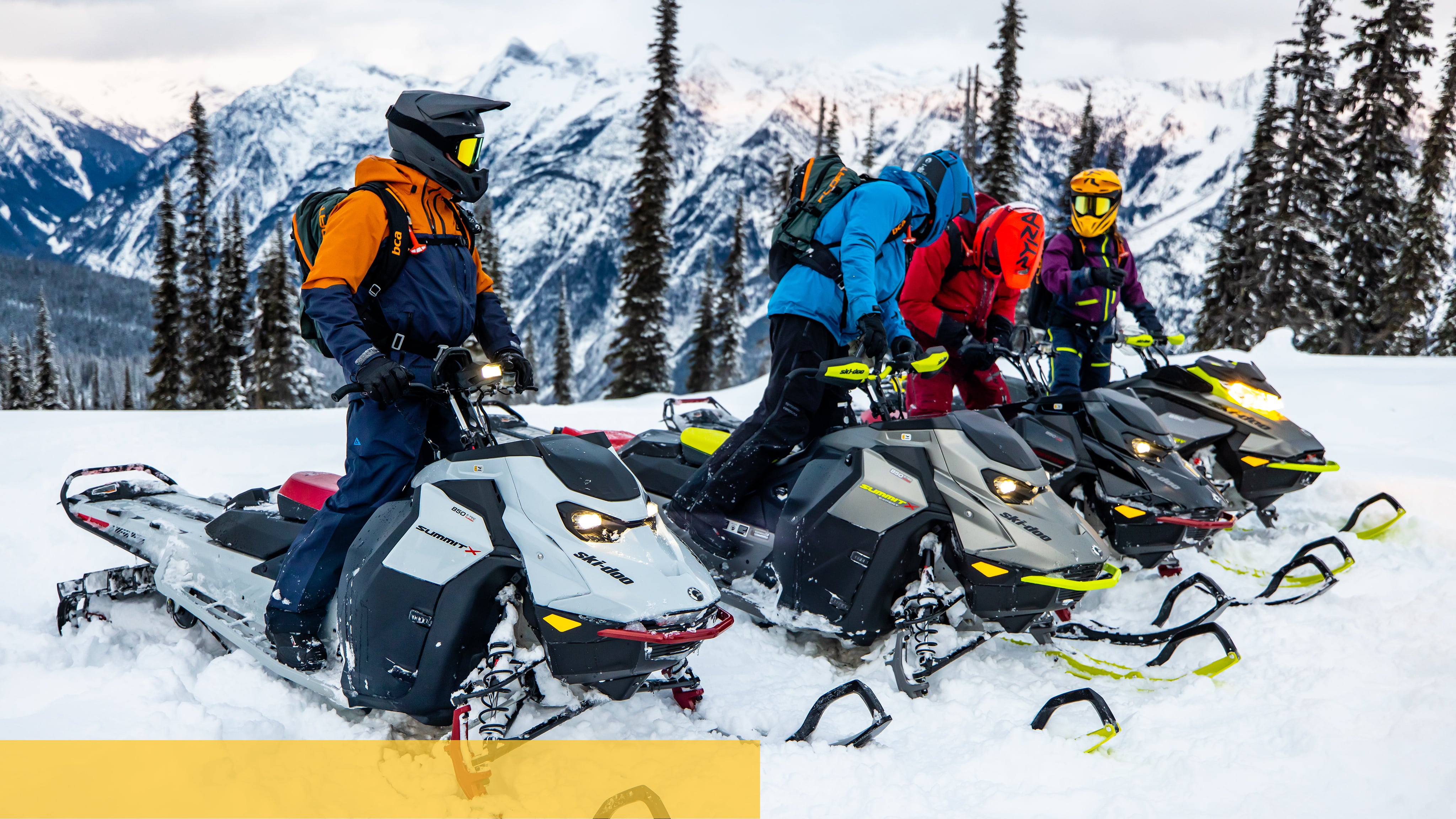 Friends talking during a ride with their Ski-Doo snowmobiles