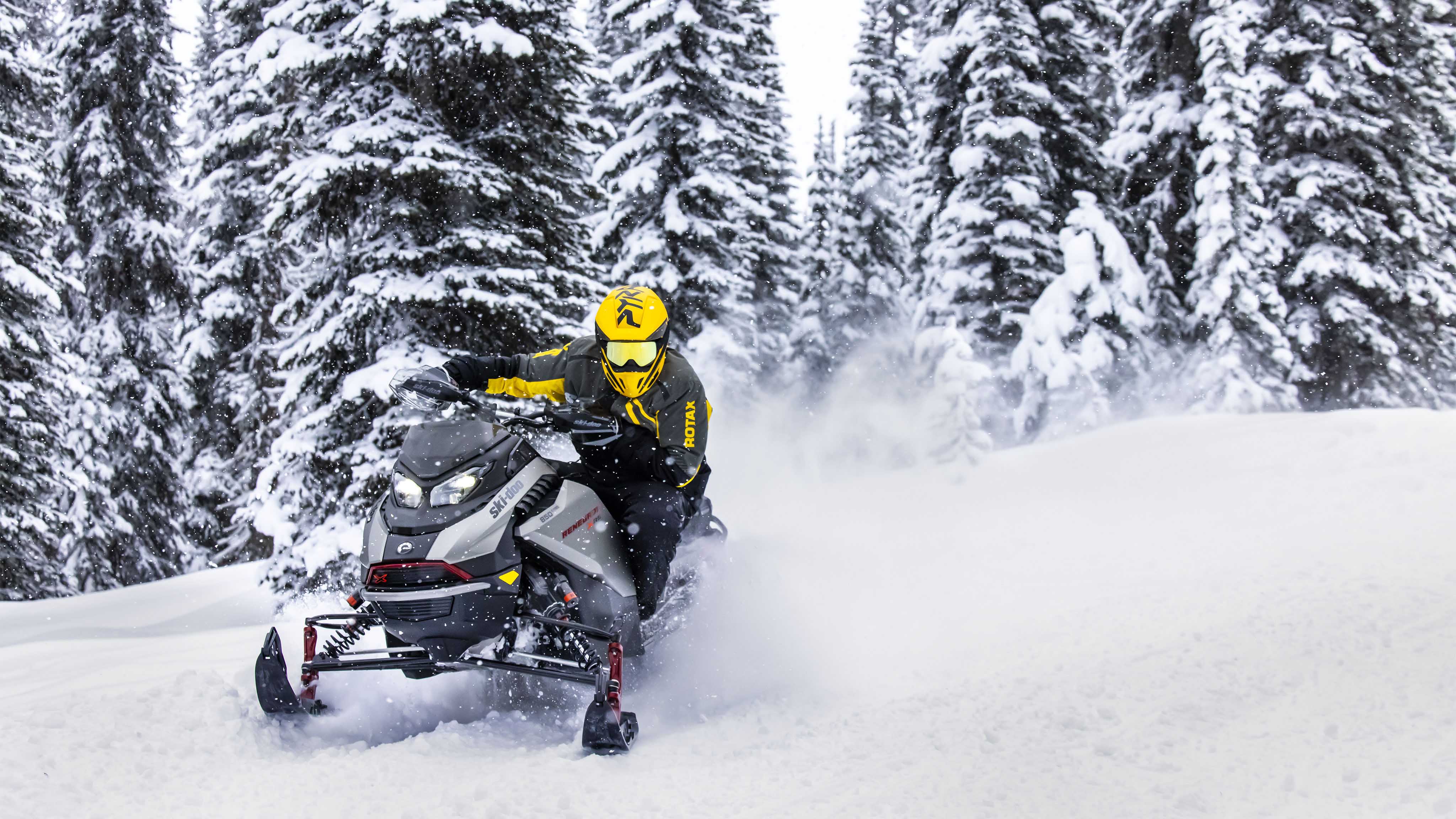 Snowmobile rider racing his Ski-Doo Renegade 2023