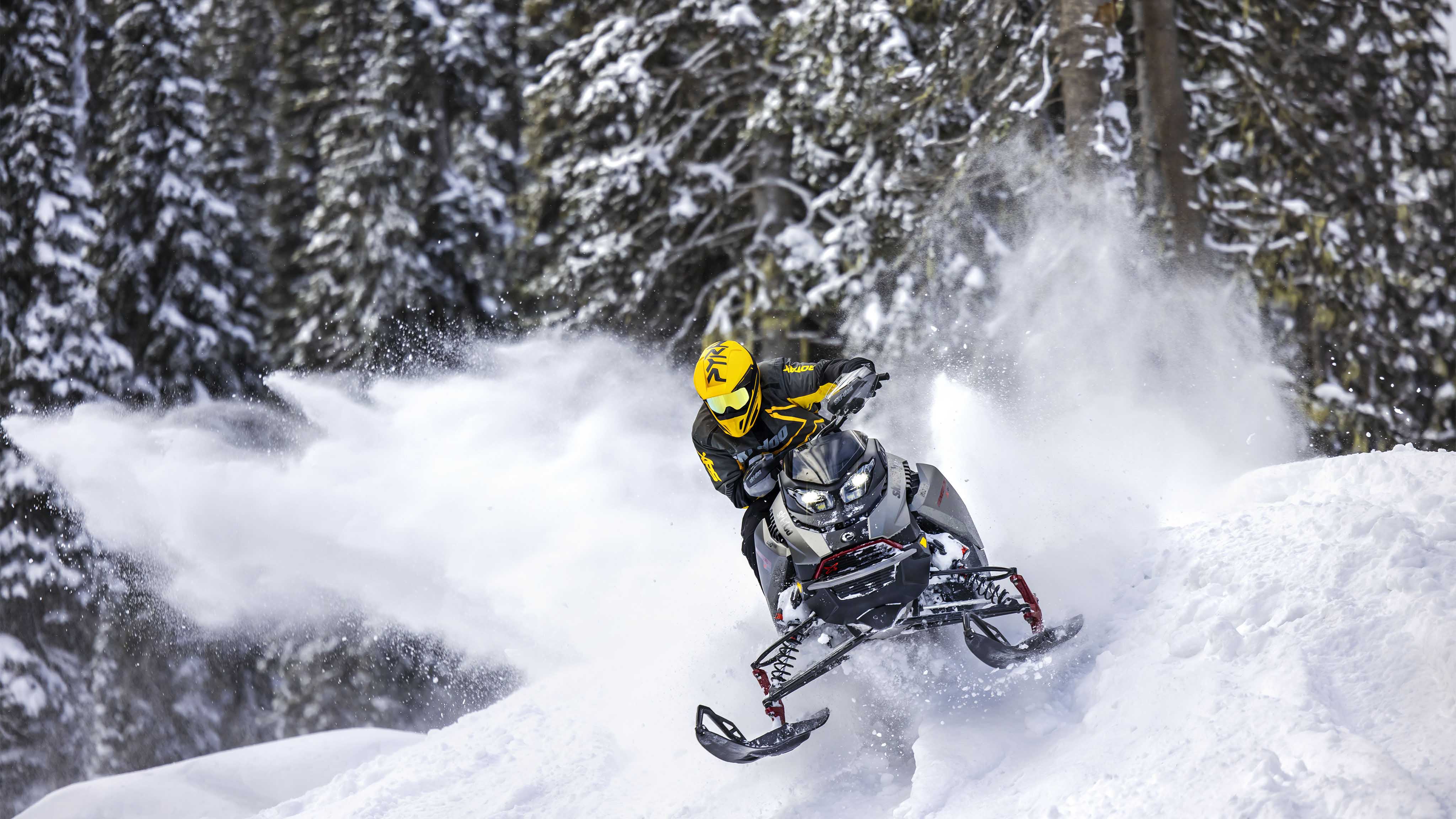 Man snowmobiling with the 2023 Ski-Doo Renegade
