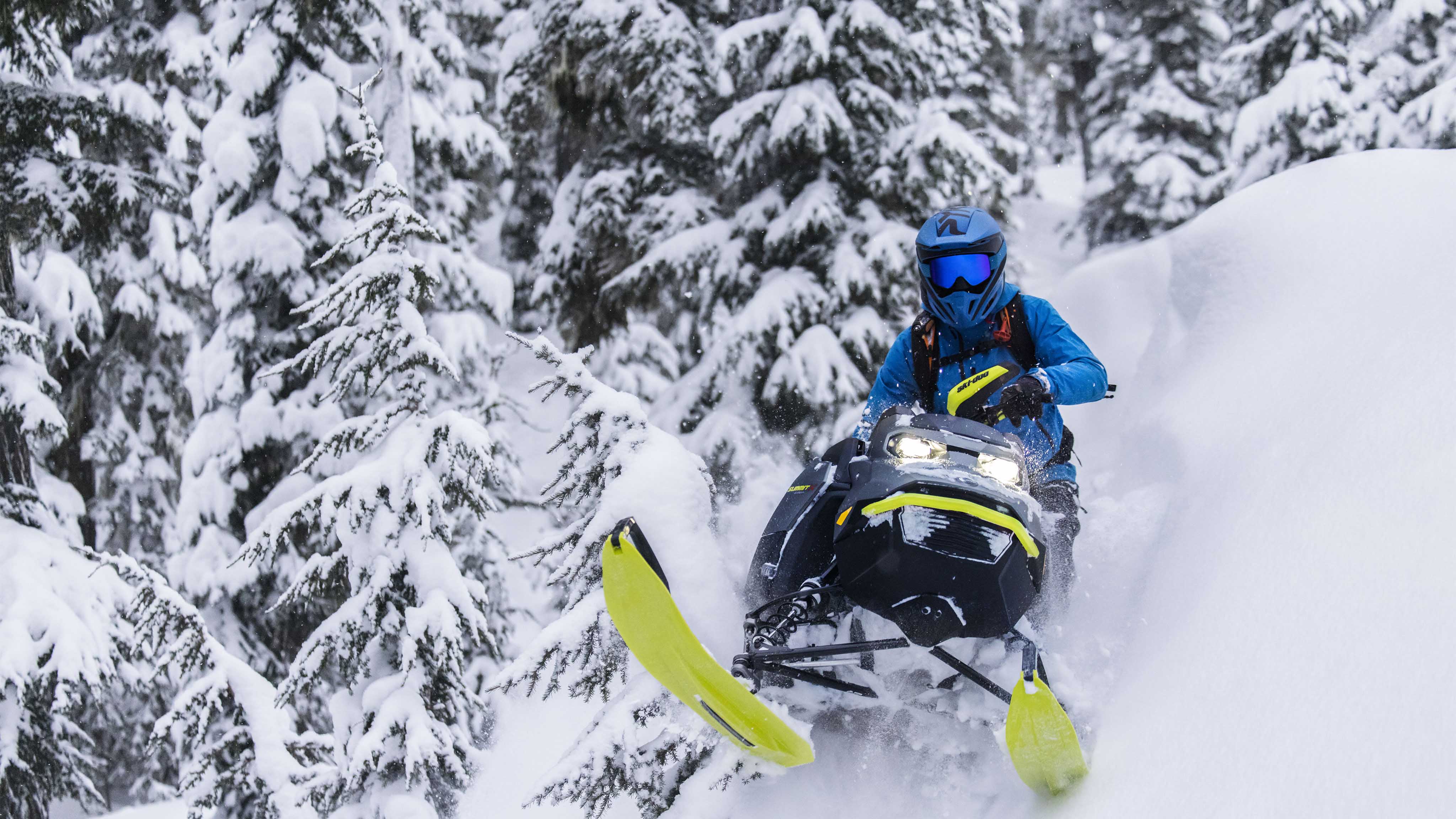 Man enjoying a snowmobile ride with the 2023 Ski-Doo Summit