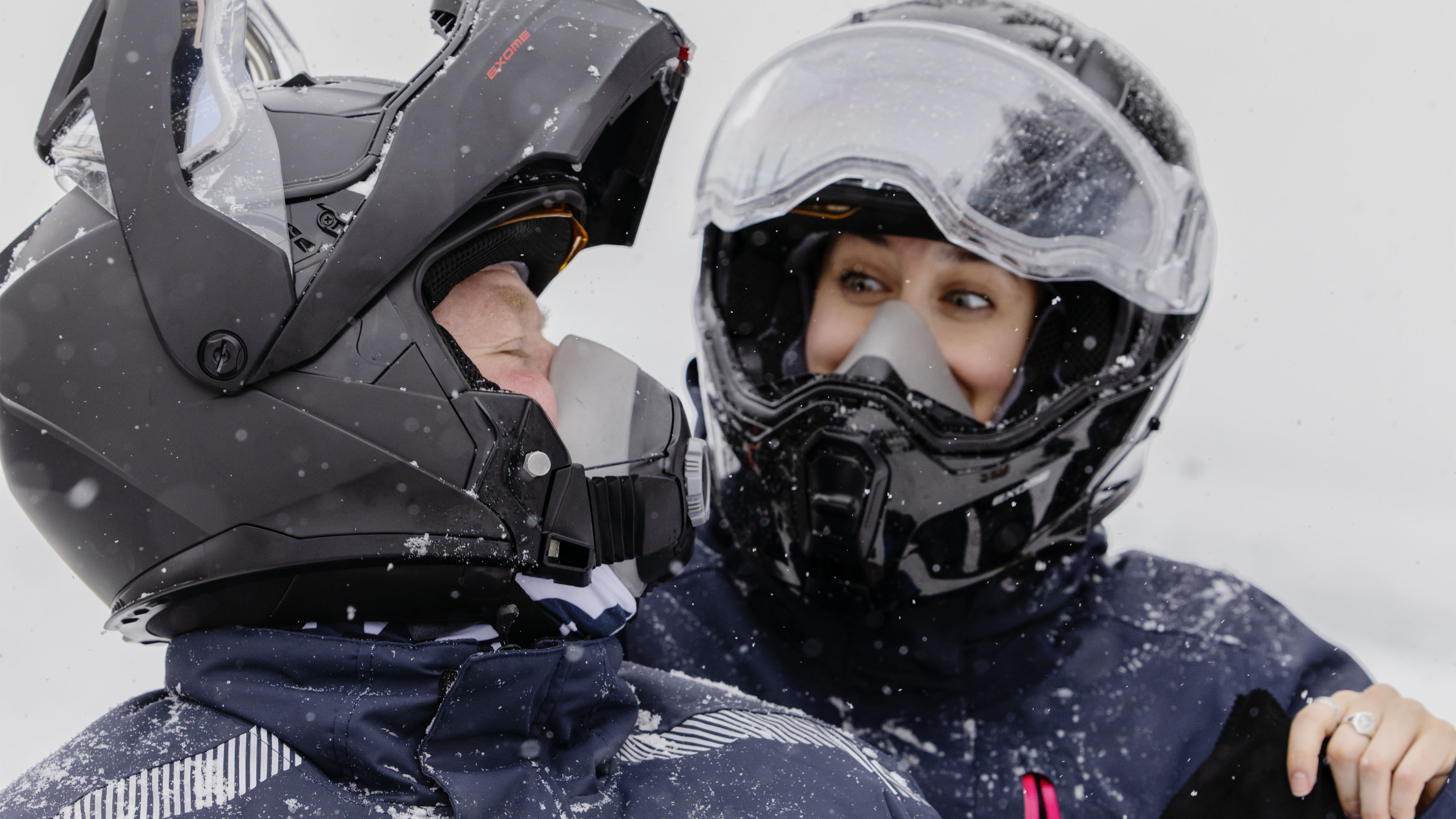 Man wearing Exome Helmet during a snowmobile ride